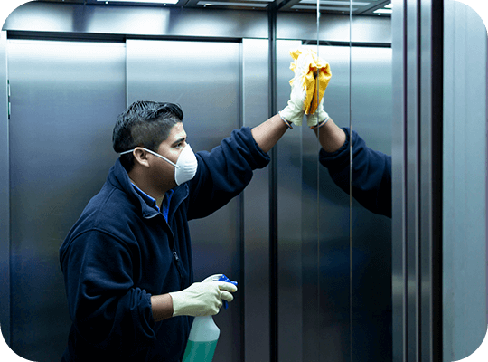 Cleaner cleaning an elevator